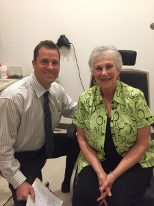 Dr. Leif Hertzog sitting with Patient Patricia H.